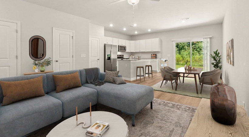 bright living room open to dining area