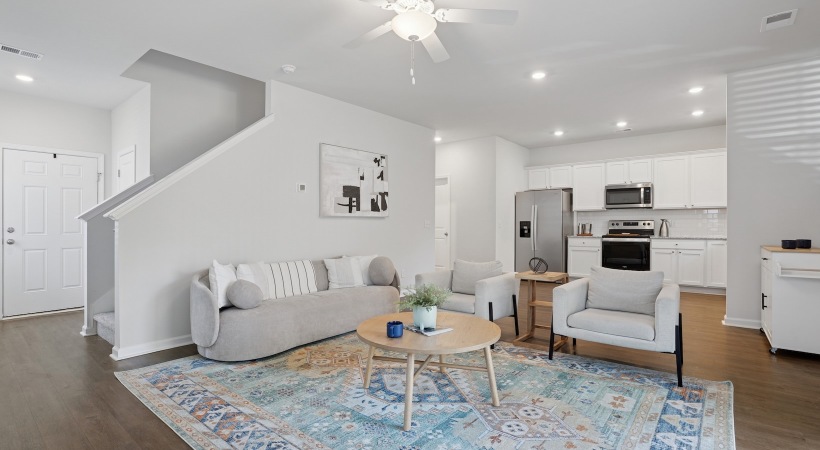 living room with a couch, chair, and coffee table